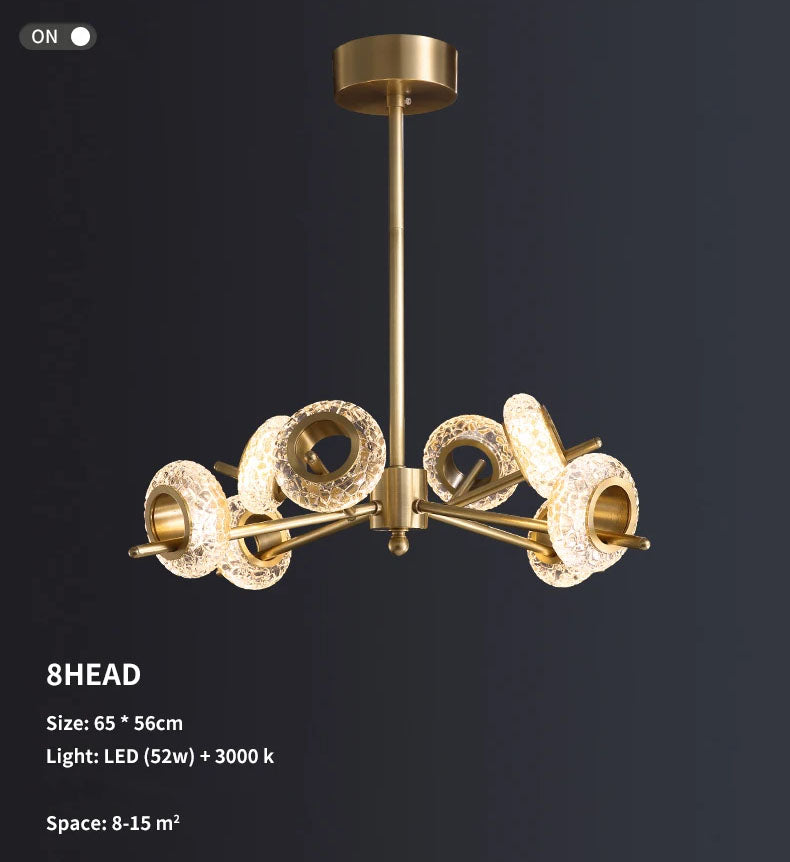 Modern LED chandelier with gold finish. This chandelier features a series of metal rings with crystal shape glass, each embedded with LED lights that cast a radiant sparkle through the glass.